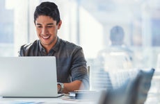 Businessman working on a laptop computer in the office