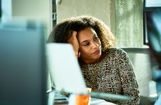 woman looking bored at desk