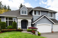 Home and healthy front yard during late spring season