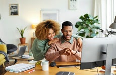 Colleagues Discussing Over Computer At Home Office