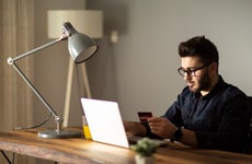 Man using credit card while online